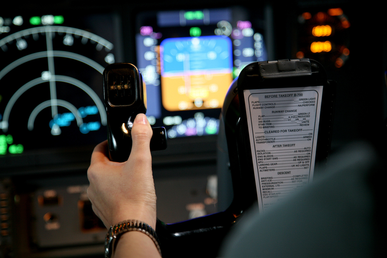 Flight simulator with pilot hand in control yoke