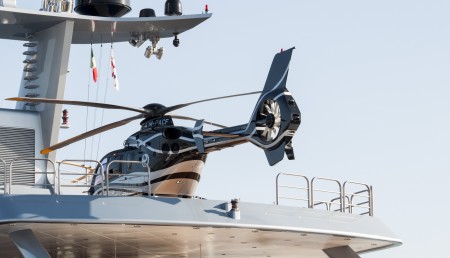 Luxury yacht with helicopter onboard